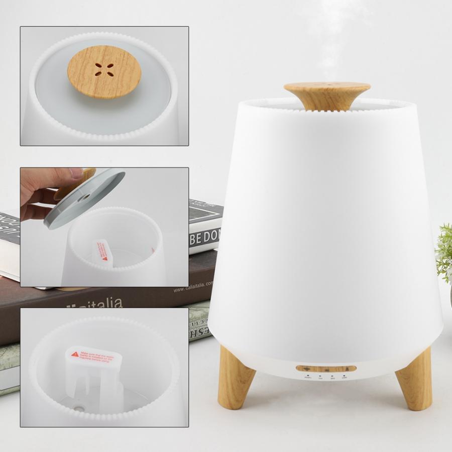 White diffuser with wooden top and legs on a white background