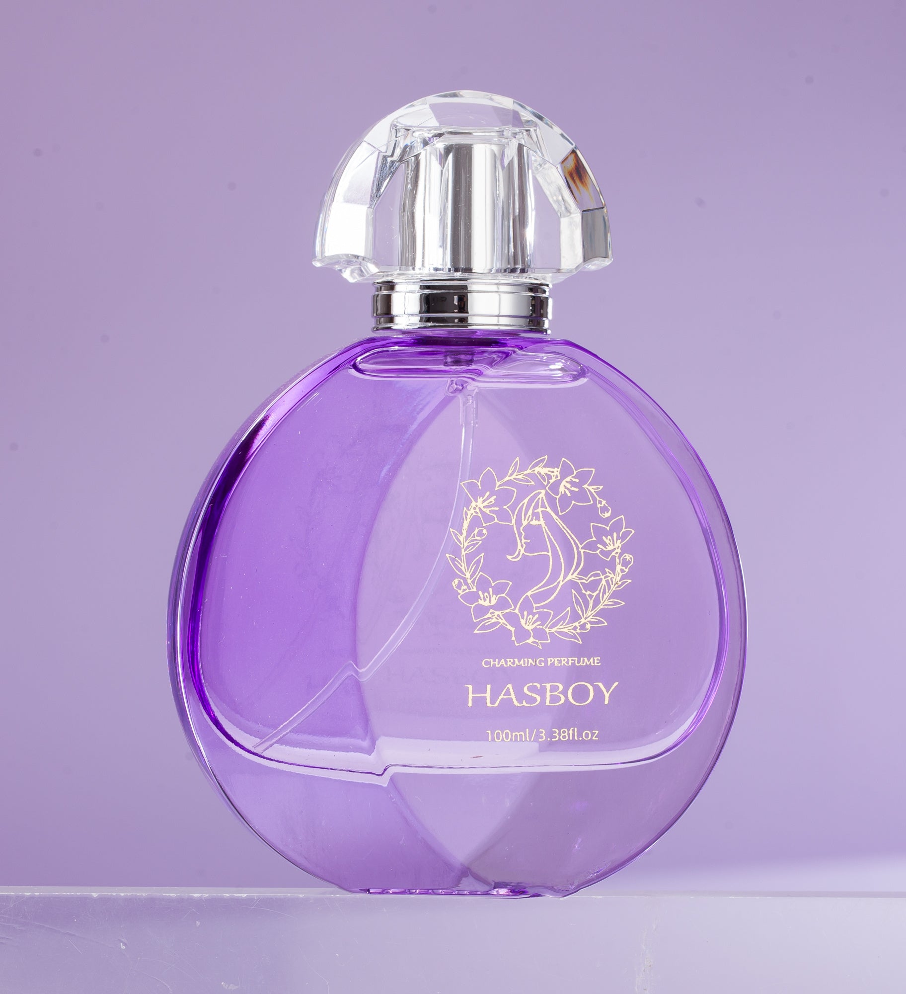 Purple perfume bottle with silver cap on a light purple background