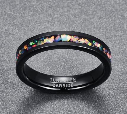 Black tungsten carbide ring with colorful inlay on a gray background