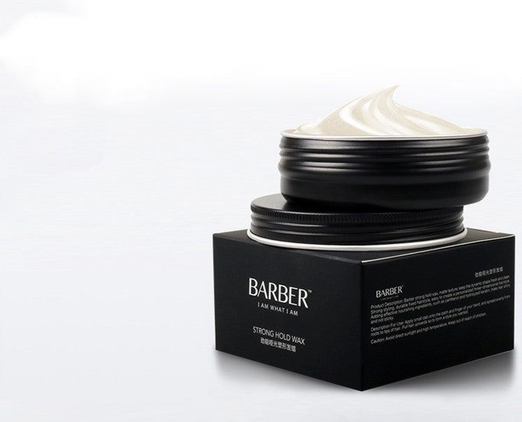 Black jar of Barber hair product with white cream on a white background