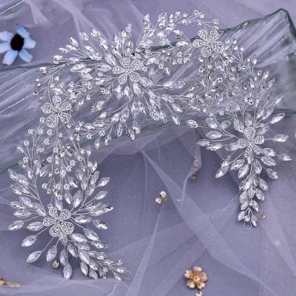 Decorative headpiece with crystals on a sheer fabric background