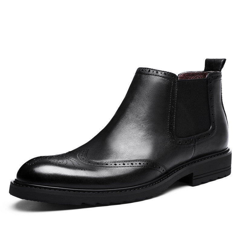 Black leather Chelsea boot on a white background
