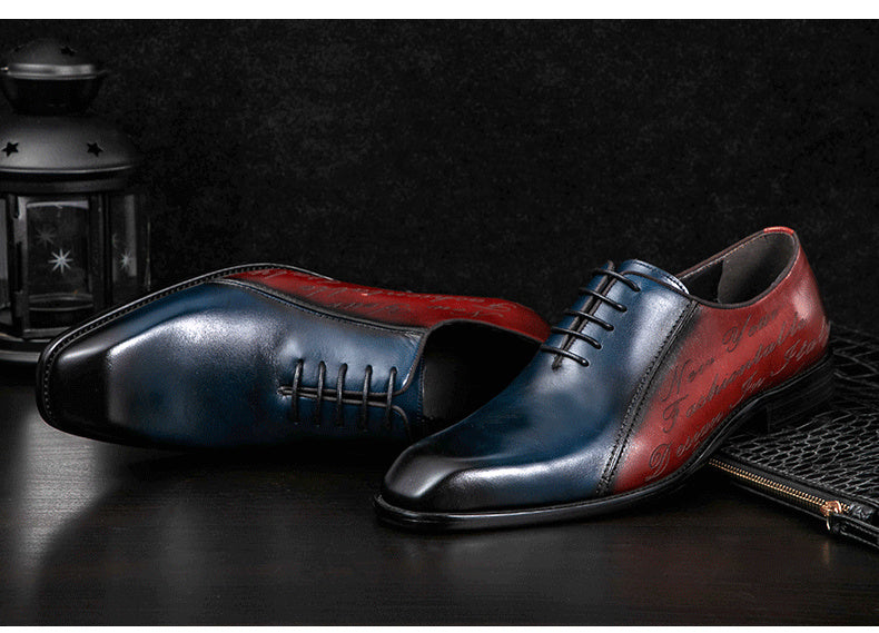 Pair of blue and red leather shoes on a dark surface with a textured background.