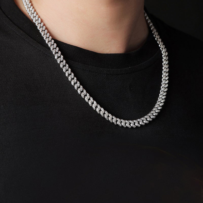 Silver chain necklace on a black background