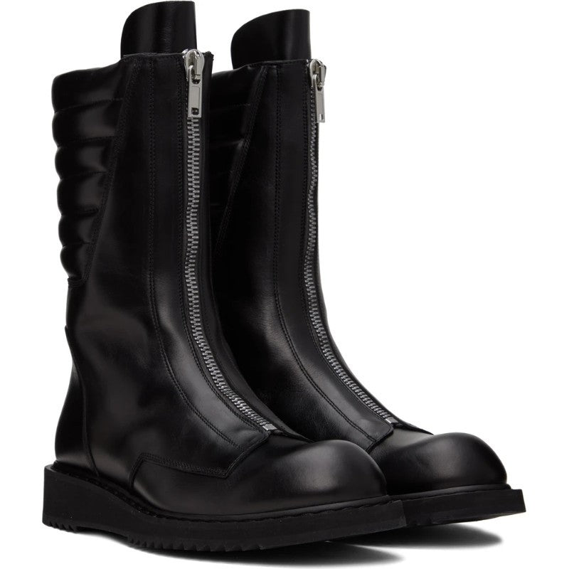Pair of black knee-high boots with zippers on a white background
