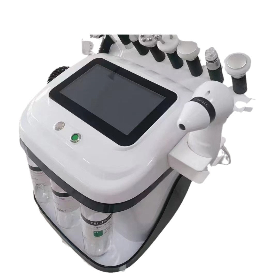 White medical device with multiple nozzles and a screen on a white background