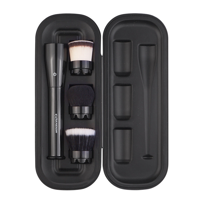 Set of makeup brushes in an open black case on a white background