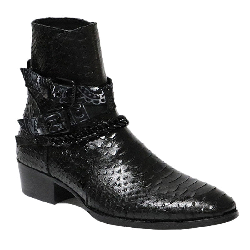 Black leather boot with embossed pattern and decorative strap on a white background