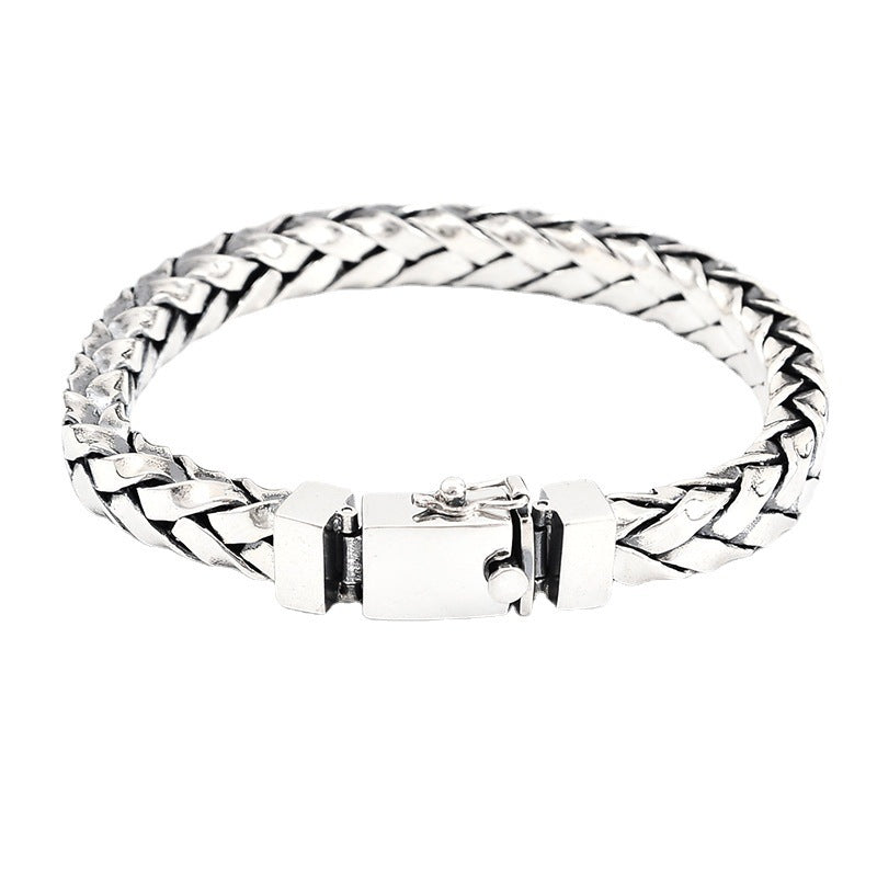 Silver braided bracelet on a white background