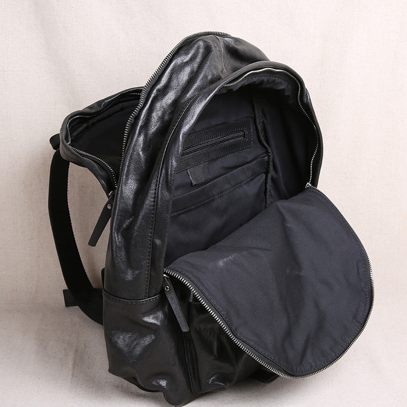 Black backpack on a light beige background