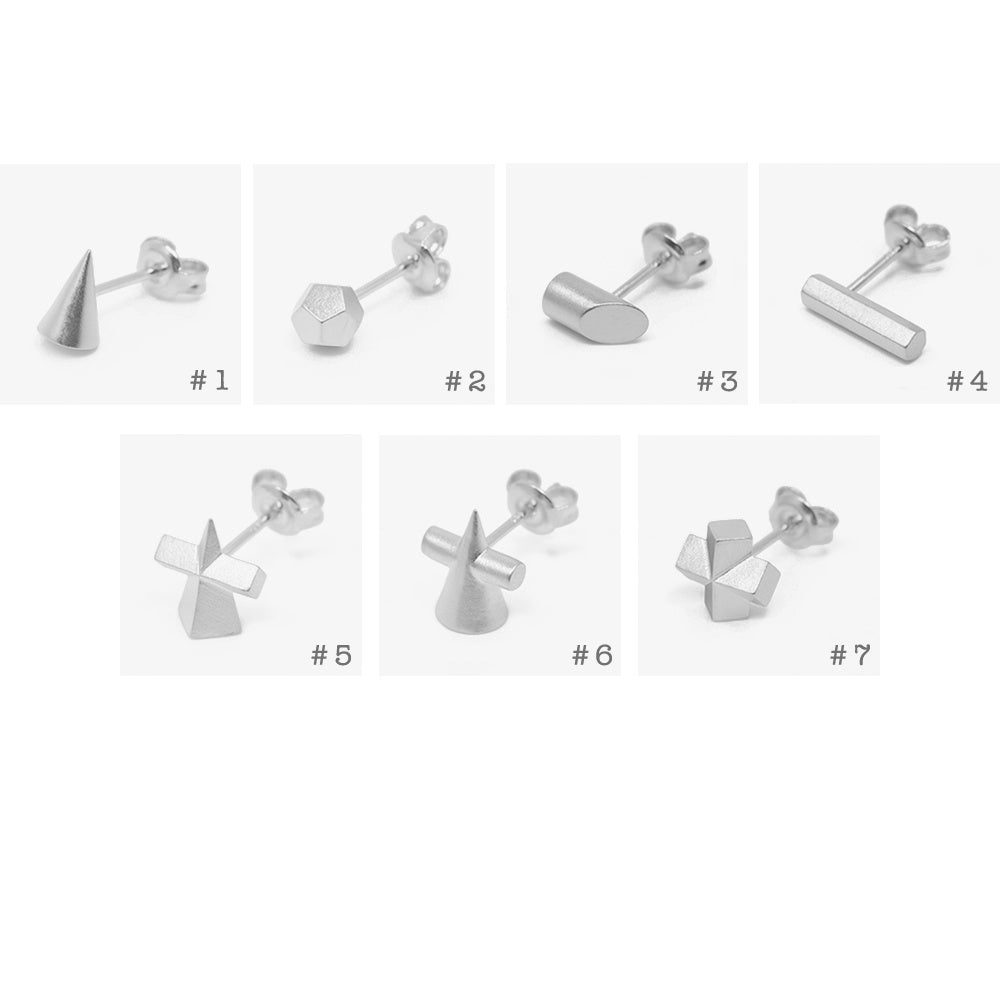 Set of silver earrings with various geometric designs on a white background
