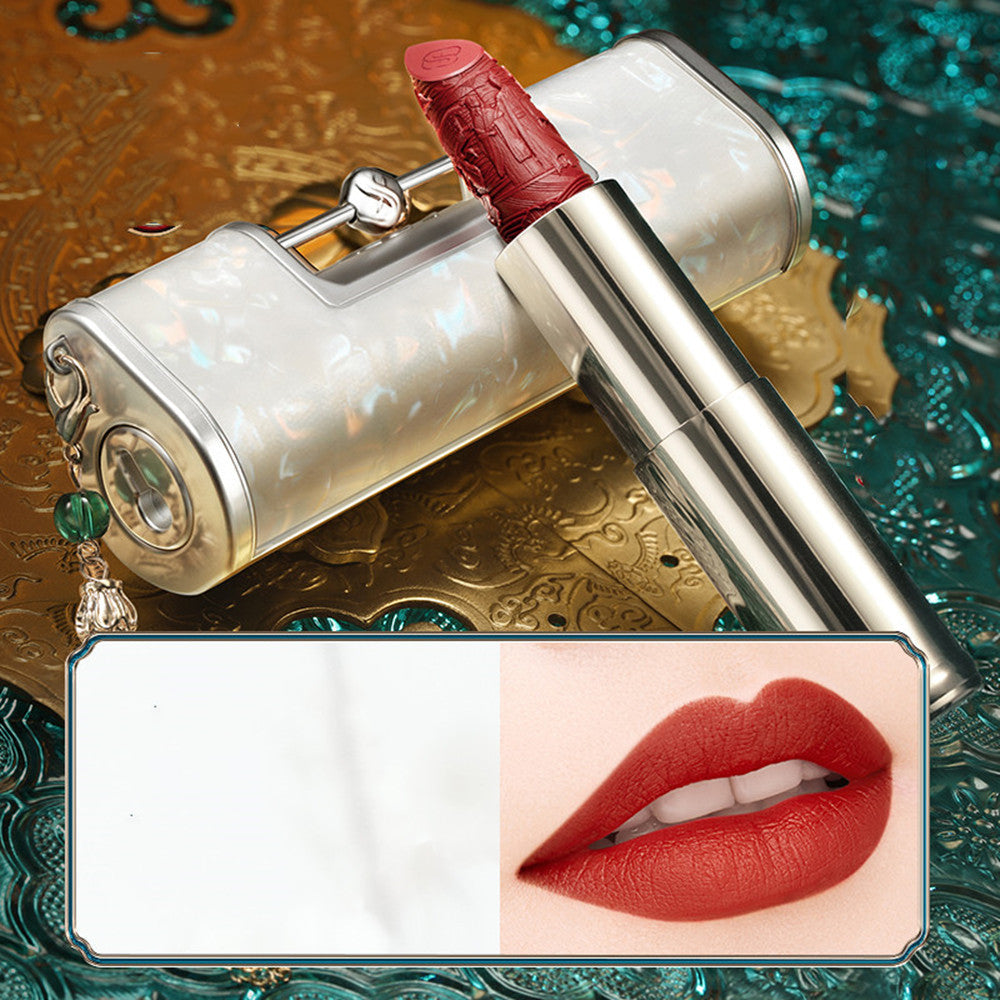 Luxury lipstick with decorative case on a decorative background, showing a close-up of lips wearing the shade.