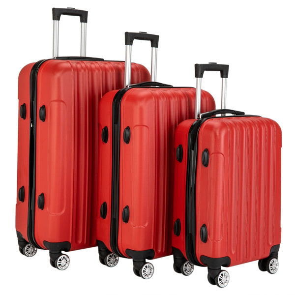Three red suitcases of different sizes on a white background