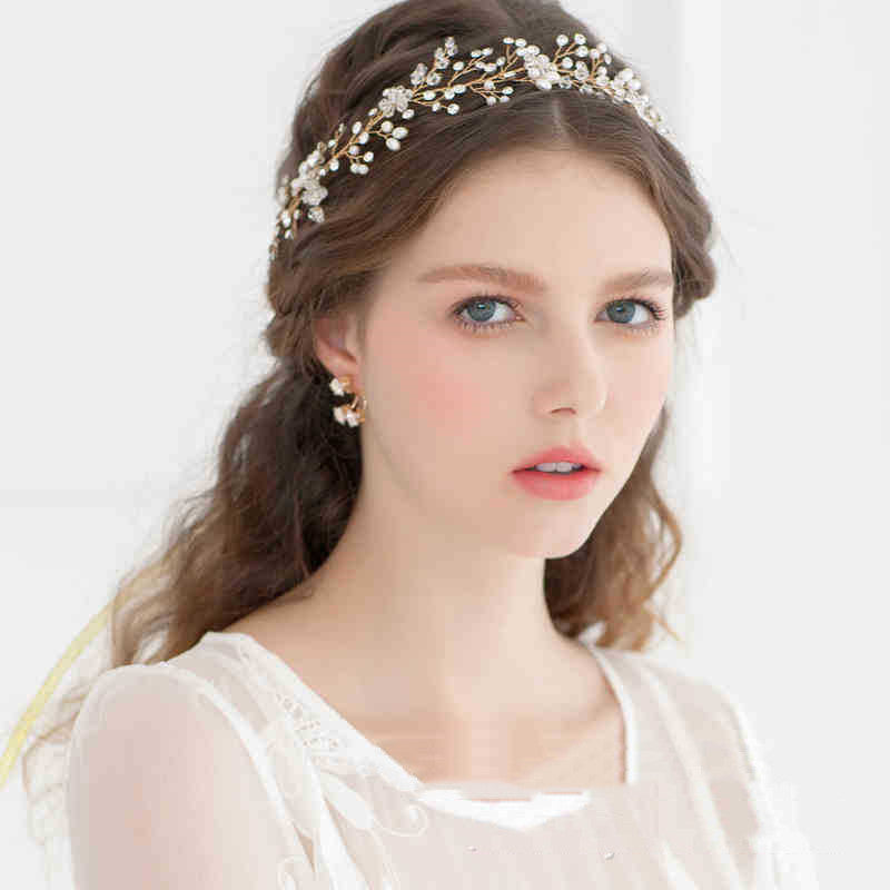 Woman wearing a decorative headband with a plain background
