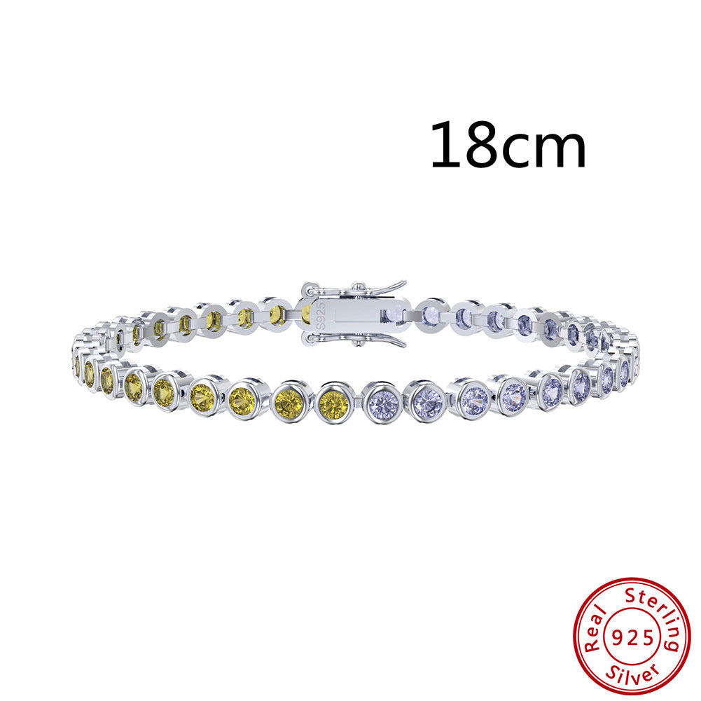 Silver bracelet with colorful stones and 'Real Sterling Silver' stamp on a white background