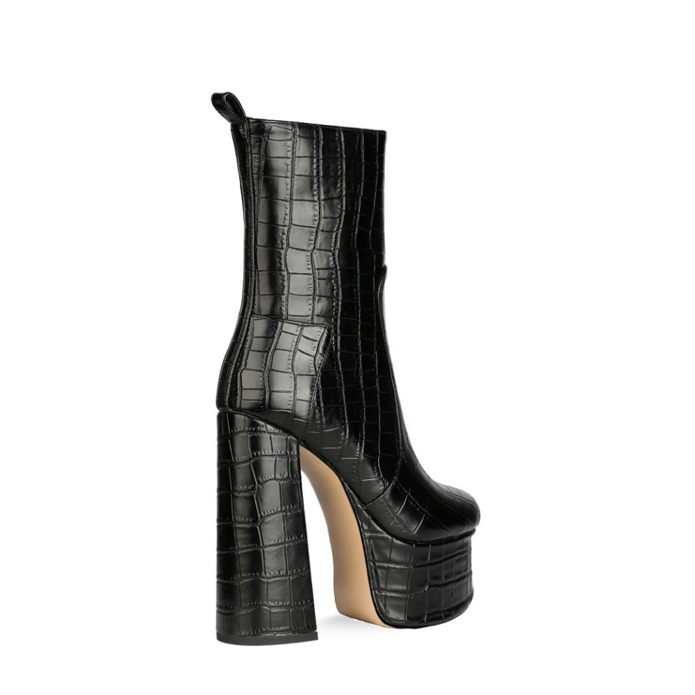 Black crocodile-patterned high-heeled boot on a white background