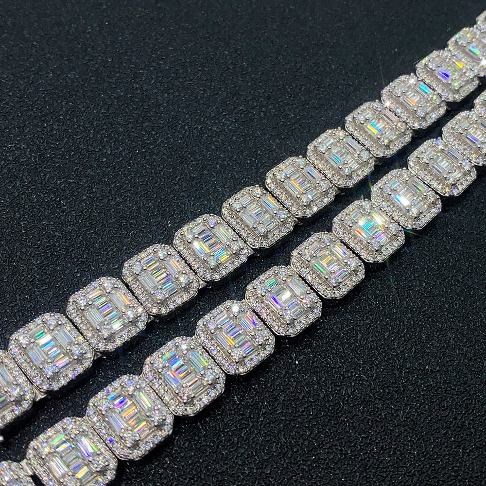 Row of diamond-studded jewelry on a black background