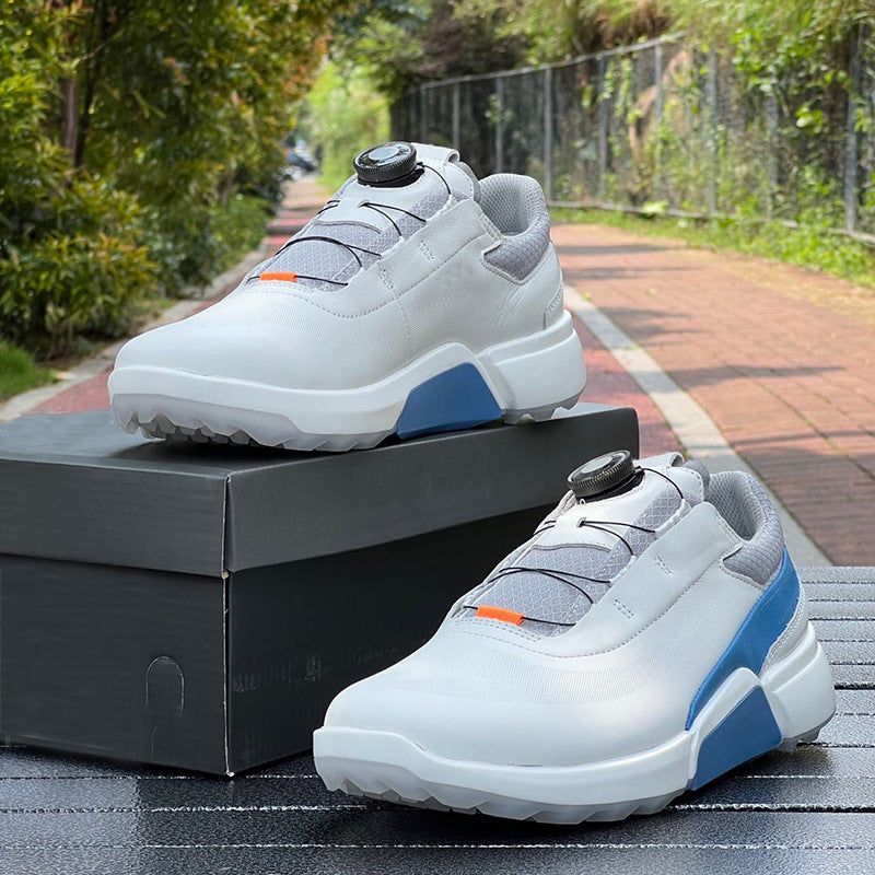 White and blue sneakers on a black box with a blurred outdoor background