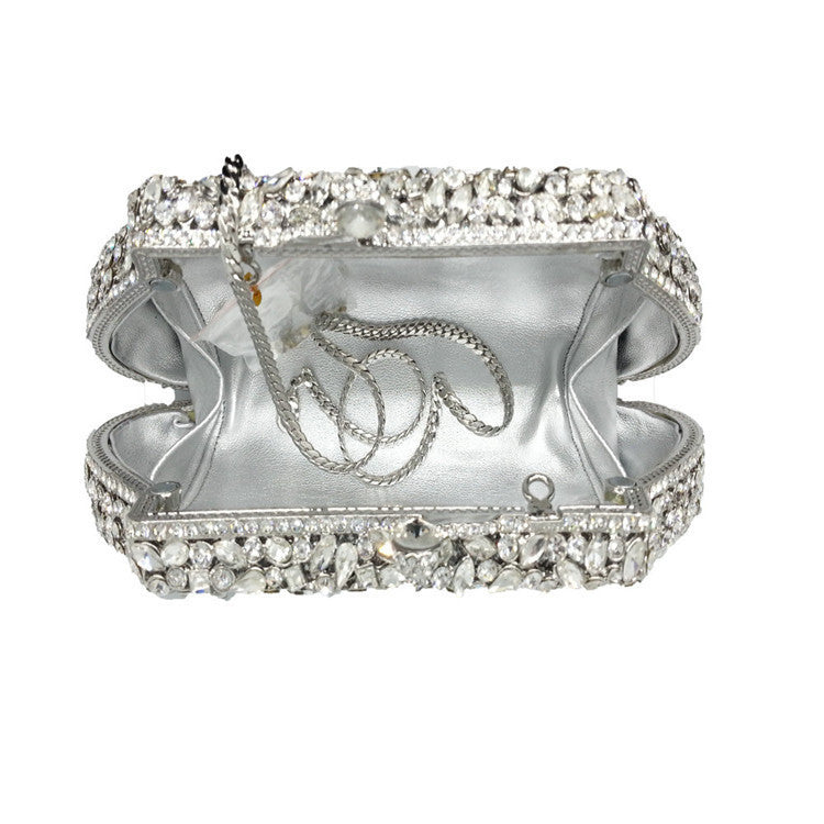 Silver bracelet with clear gemstones on a white background