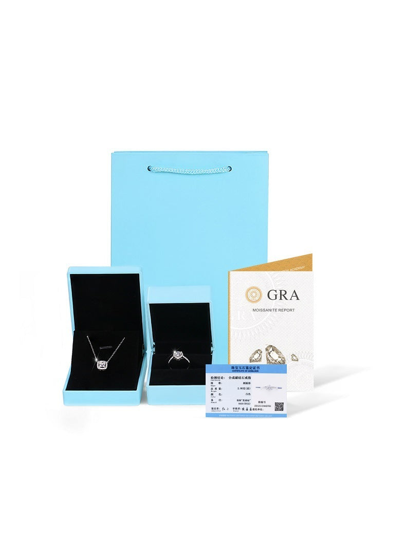 Jewelry set with packaging and GRA certificate on a white background