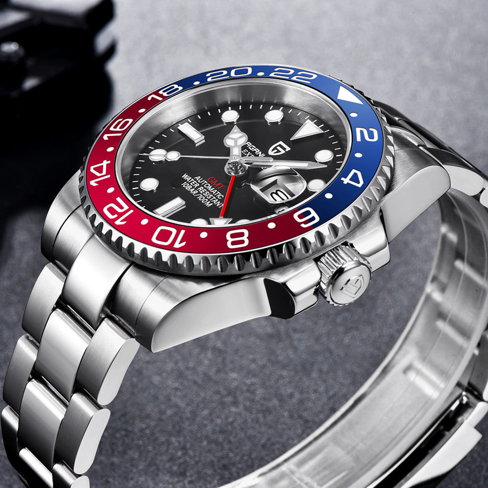 Wristwatch with a distinctive red and blue bezel on a gray background