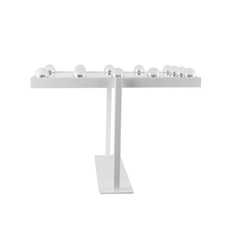 White metal menorah with six candles on a white background