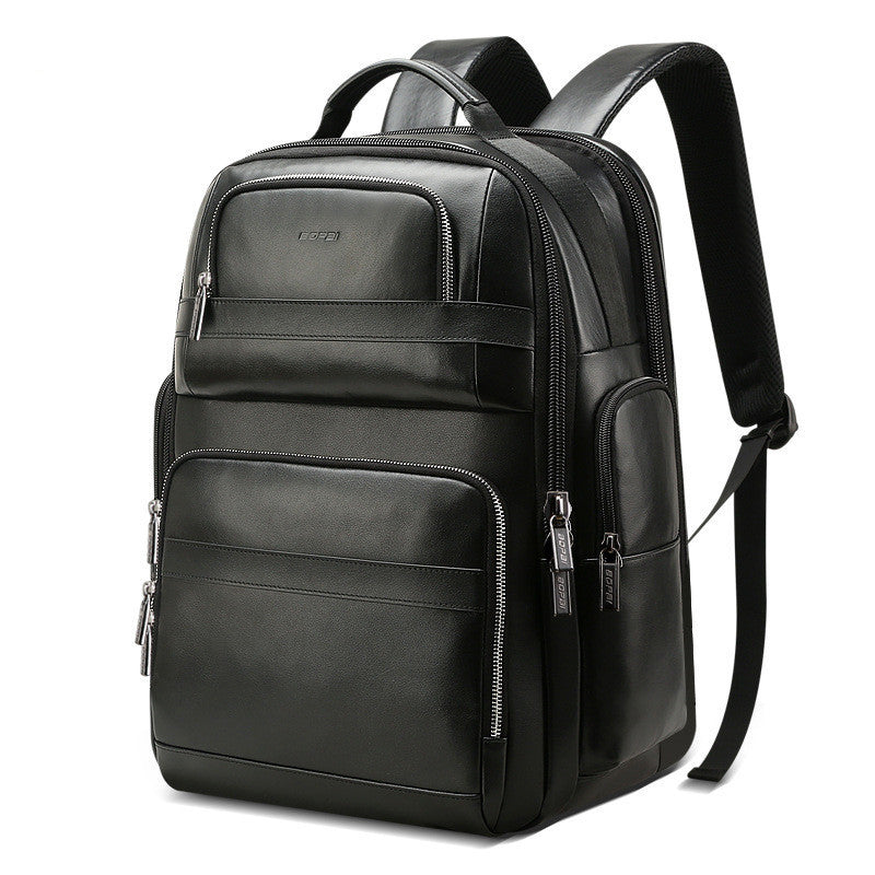 Black leather backpack with multiple pockets and zippers on a white background