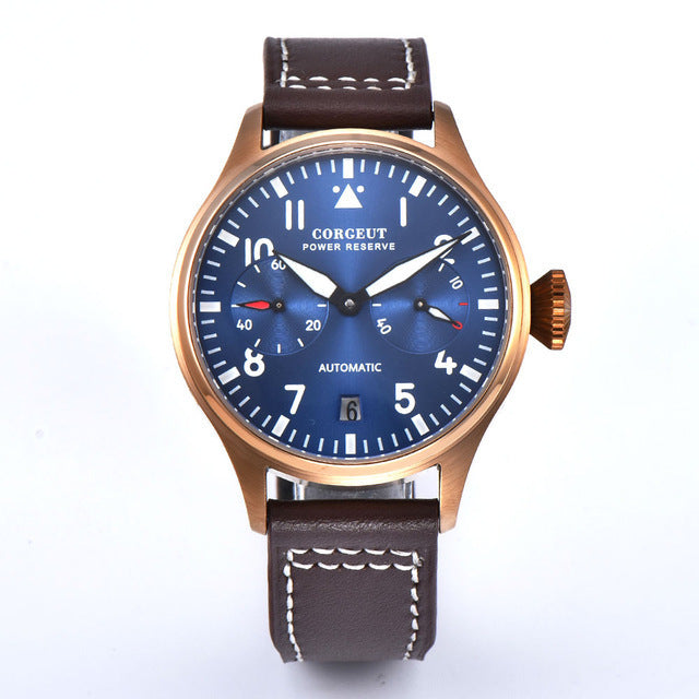 Watch with blue dial and brown leather strap on a white background