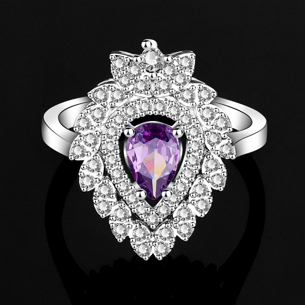 Silver ring with a purple gemstone on a black background