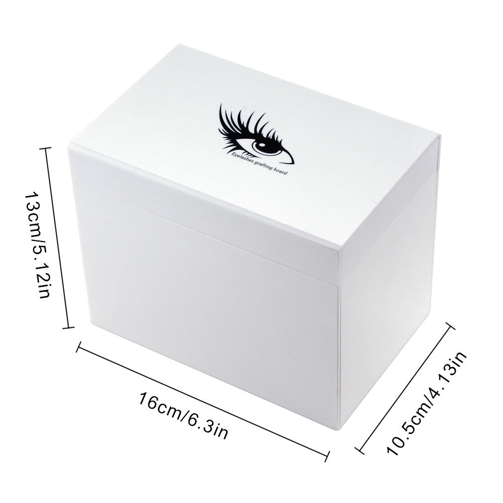 White box with eyelash design and dimensions on a white background