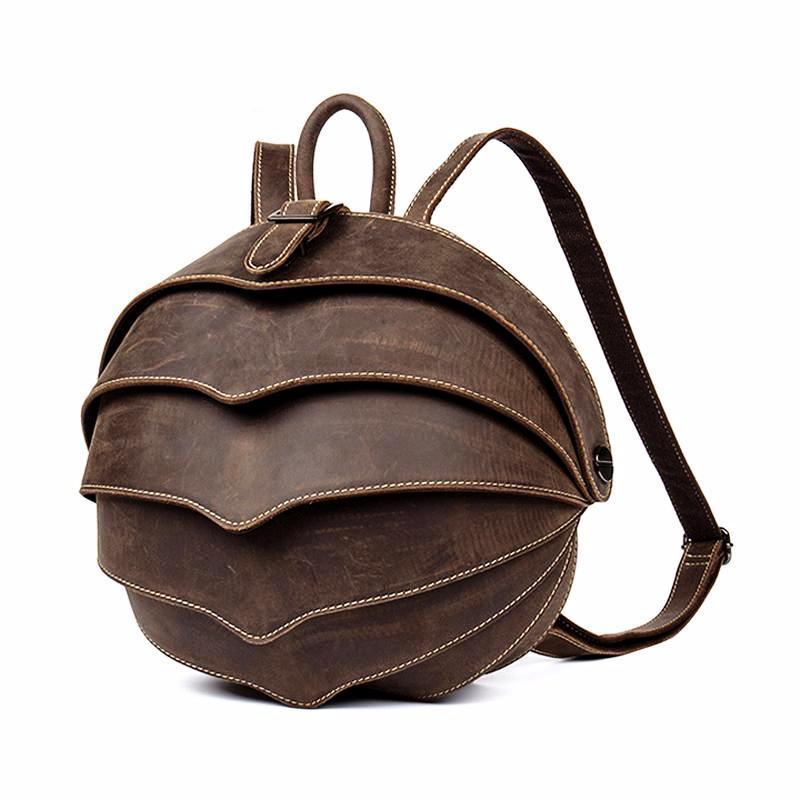 Brown leather backpack on a white background
