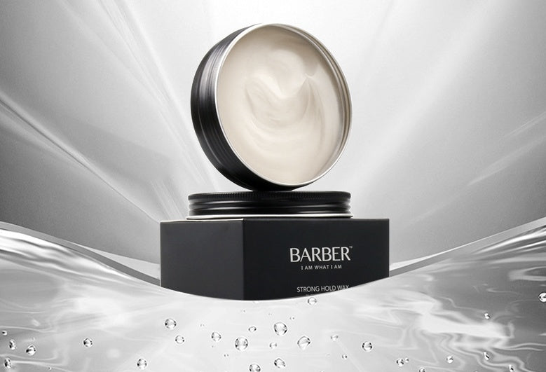 Barber strong hold wax jar on a reflective surface with a gray background