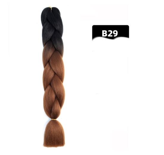 Braided hair extension with black to brown gradient on a white background