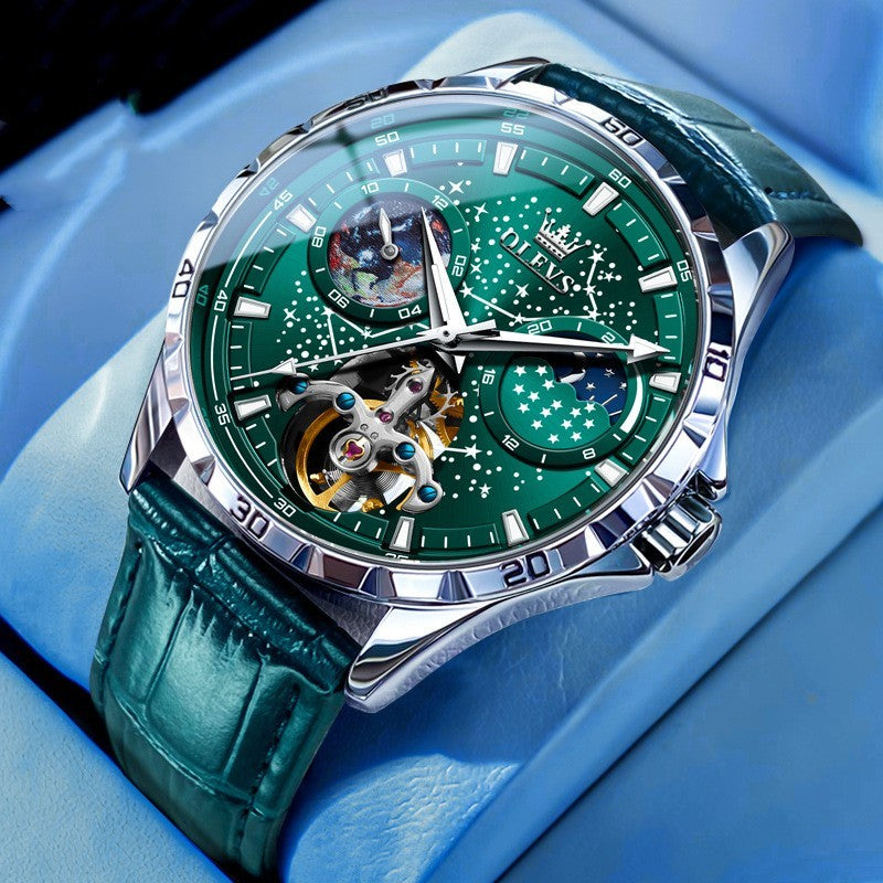 Green wristwatch with detailed face on a blue background