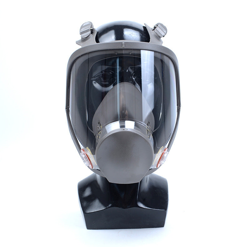 Full-face safety mask on a mannequin head against a white background