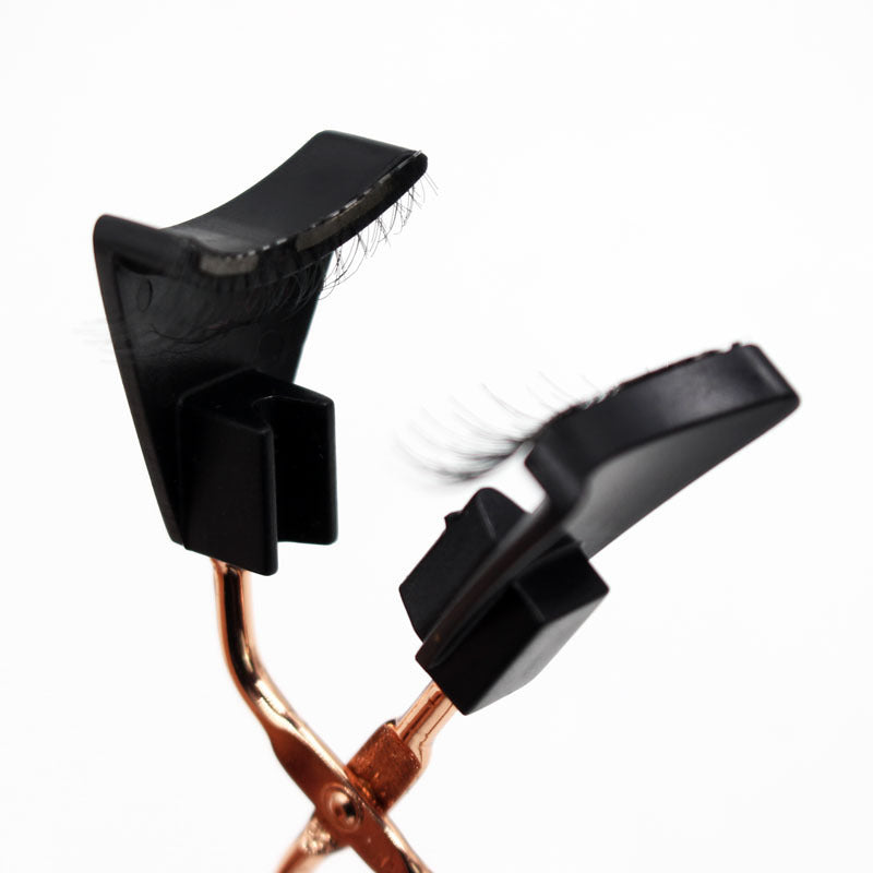 Black hair curler with rose gold base on a white background