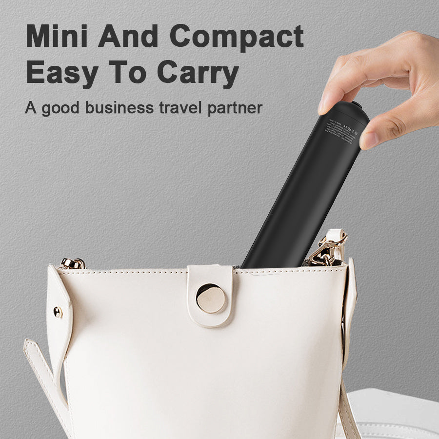 Black cylindrical product being placed into a white handbag with text about its compact size.