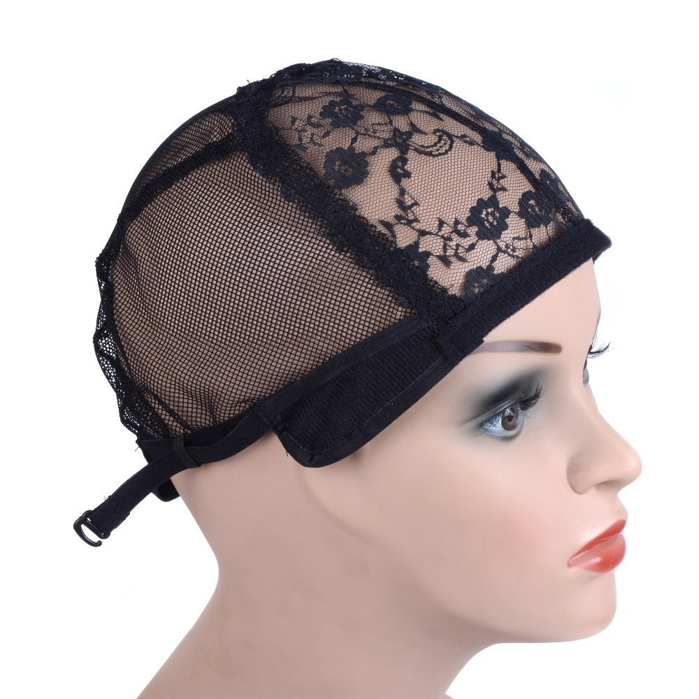 Black lace wig cap on a mannequin head against a white background