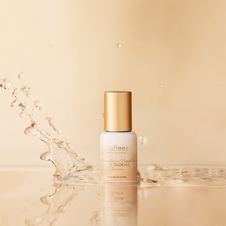 Skincare bottle with gold cap on a beige background