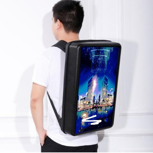 Person wearing a futuristic backpack with a digital display showing a cityscape.