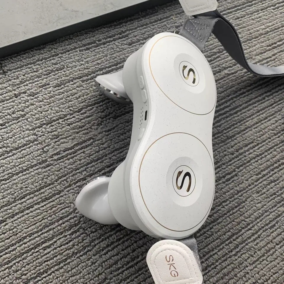 White earbuds with a charging case on a textured gray surface
