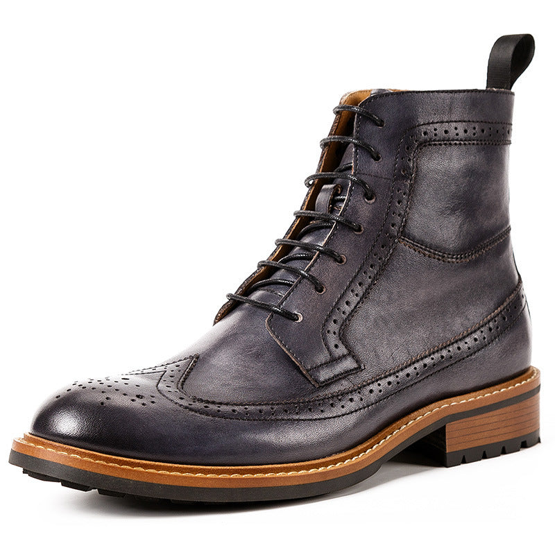 Dark gray leather boot with brown sole on a white background
