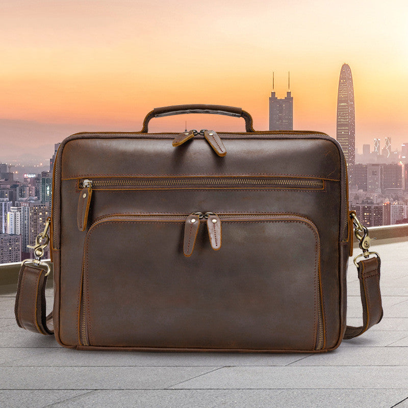 Brown leather briefcase with city skyline in the background