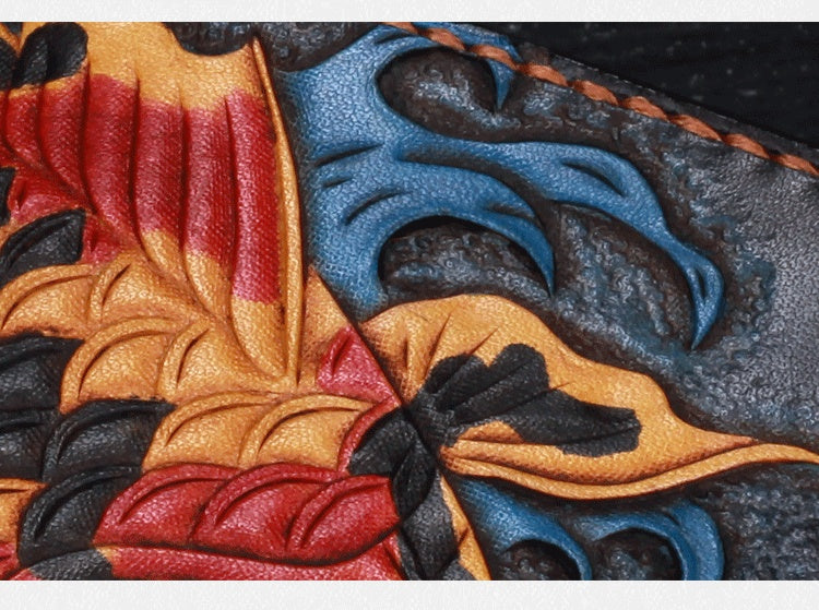 Close-up of colorful leather with intricate patterns and stitching.