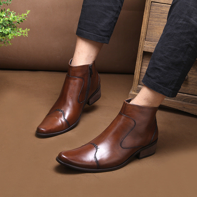 Brown leather ankle boots worn indoors on a brown floor.