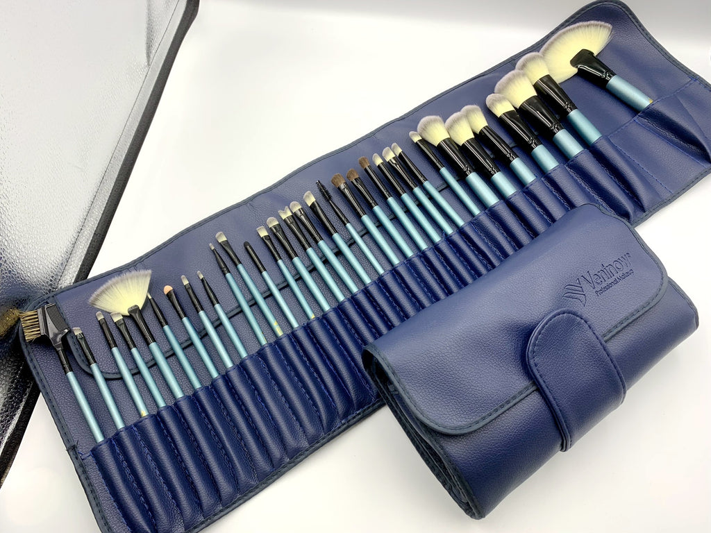 Set of makeup brushes in a blue case on a white background