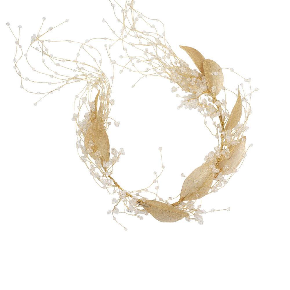 Decorative wreath with gold leaves and small white flowers on a white background
