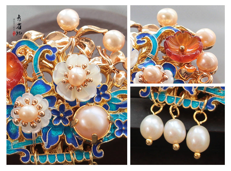 Ornate jewelry piece with pearls and colored stones on a dark background