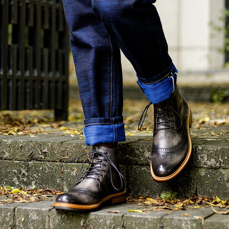 Person wearing dark brown leather shoes with brown soles on a stone step.