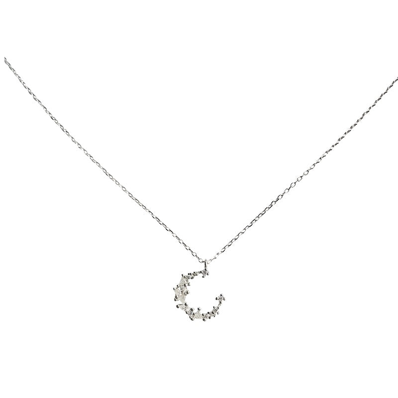 Silver necklace with a crescent moon pendant on a white background